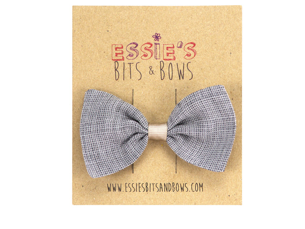 linen Anna hair bow in grey mon a display card