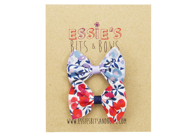 Liberty Wiltshire E and S baby bows on a display card