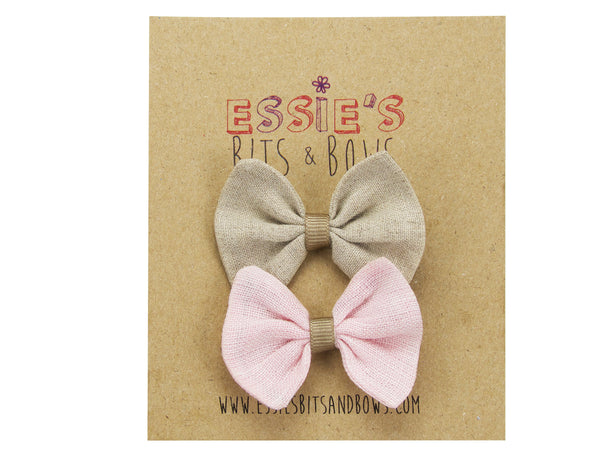 khaki and pink baby bows on a display board